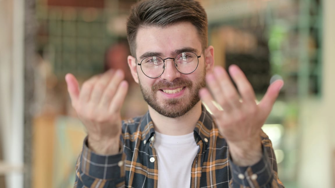 Young Man Inviting to Join Him